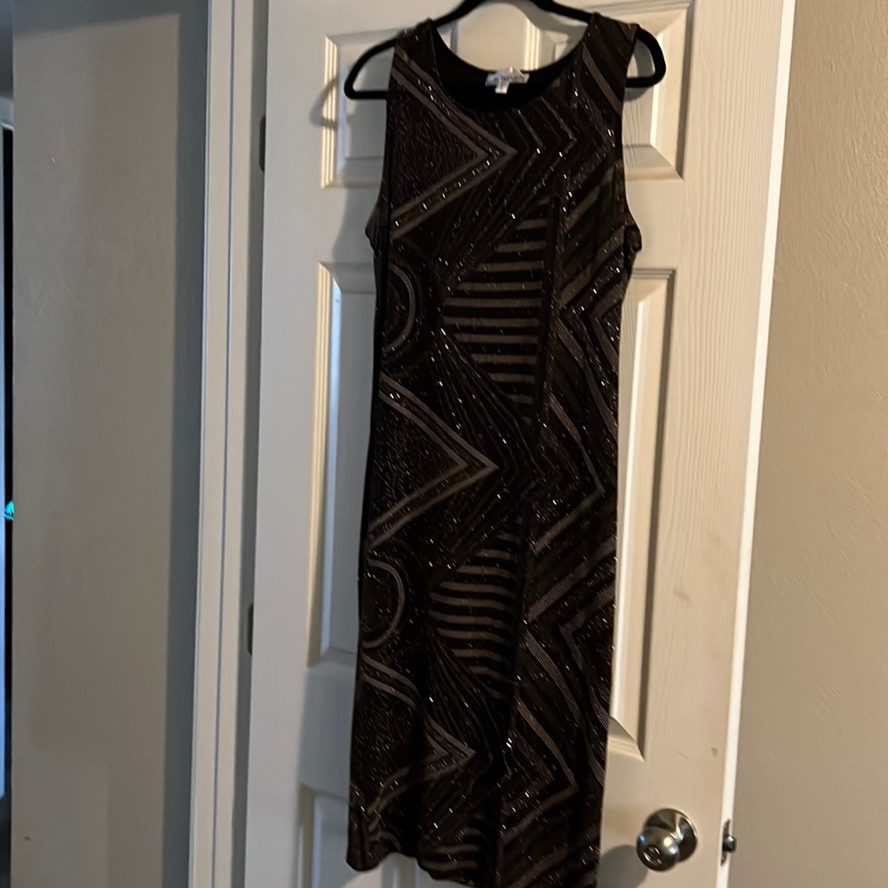 Large worn once shimmery black gold dress. Great for any special occasion.